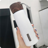 Gourde isotherme inox et bois blanche